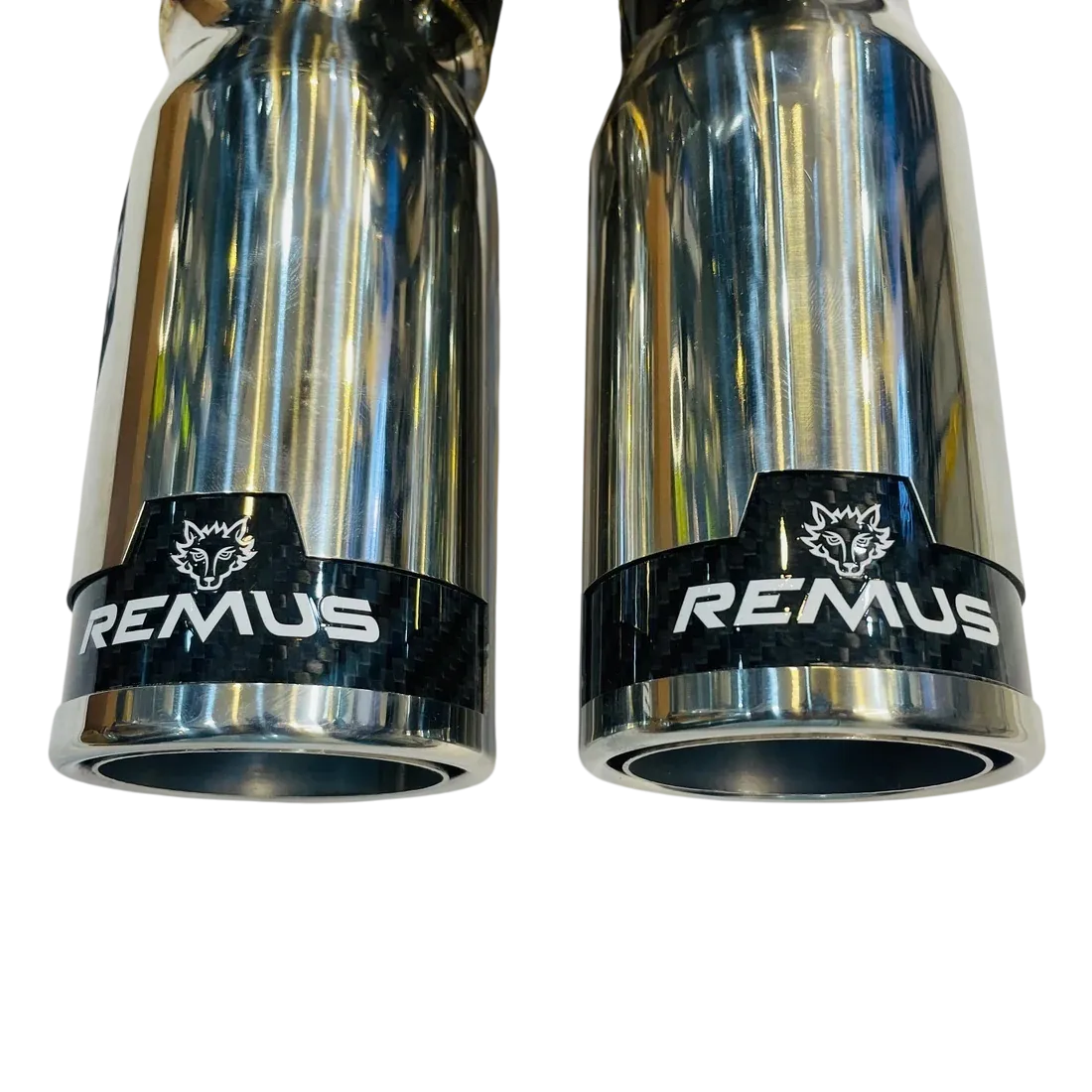 Remus dual tip carbon valvetronic exhaust carbon fiber tips closeup Remus dual tip carbon valvetronic exhaust carbon fiber tips closeup