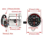 Close-up of analog dials showing km/h and RPM