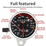 Front view of vintage retro dual speedometer tachometer motorcycle gauge
